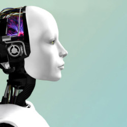 Side profile of a futuristic humanoid robot with a white face and visible mechanical components against a pale blue background.