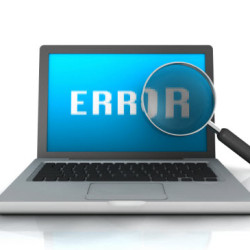 Laptop screen displaying the word 'ERROR' with a magnifying glass highlighting the letter 'R'.