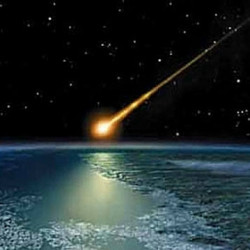 A bright meteor streaks across the night sky above Earth, illuminating the atmosphere and ocean below.