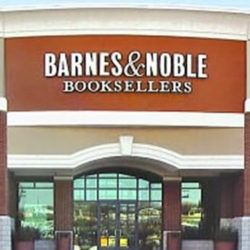 A barnes & noble store front with the sign lit up.