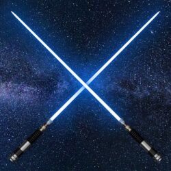 Two crossed lightsaber swords in front of a space background.
