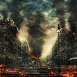 A city is burning down and people are walking.